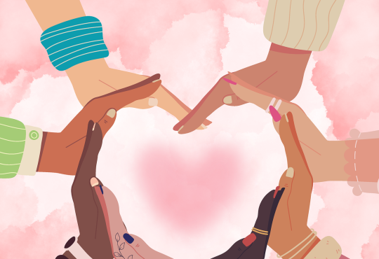 Personnes d'origines différentes qui forment un coeur avec leurs mains.